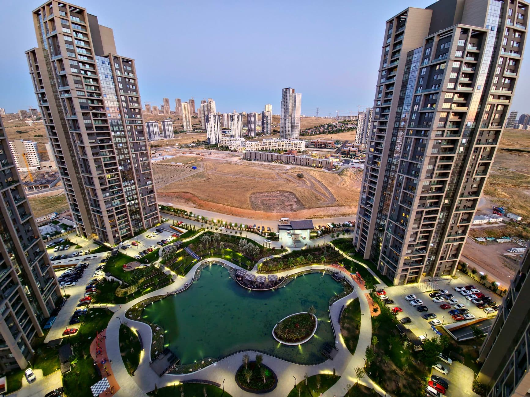 A stunning aerial view of a modern urban development with skyscrapers and a water feature in Ankara, Turkey.