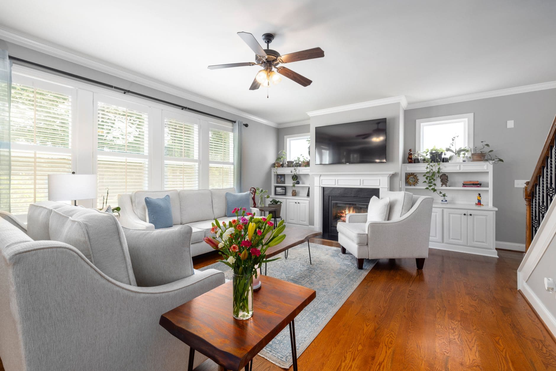 Bright and stylish living room with fireplace and elegant furniture.
