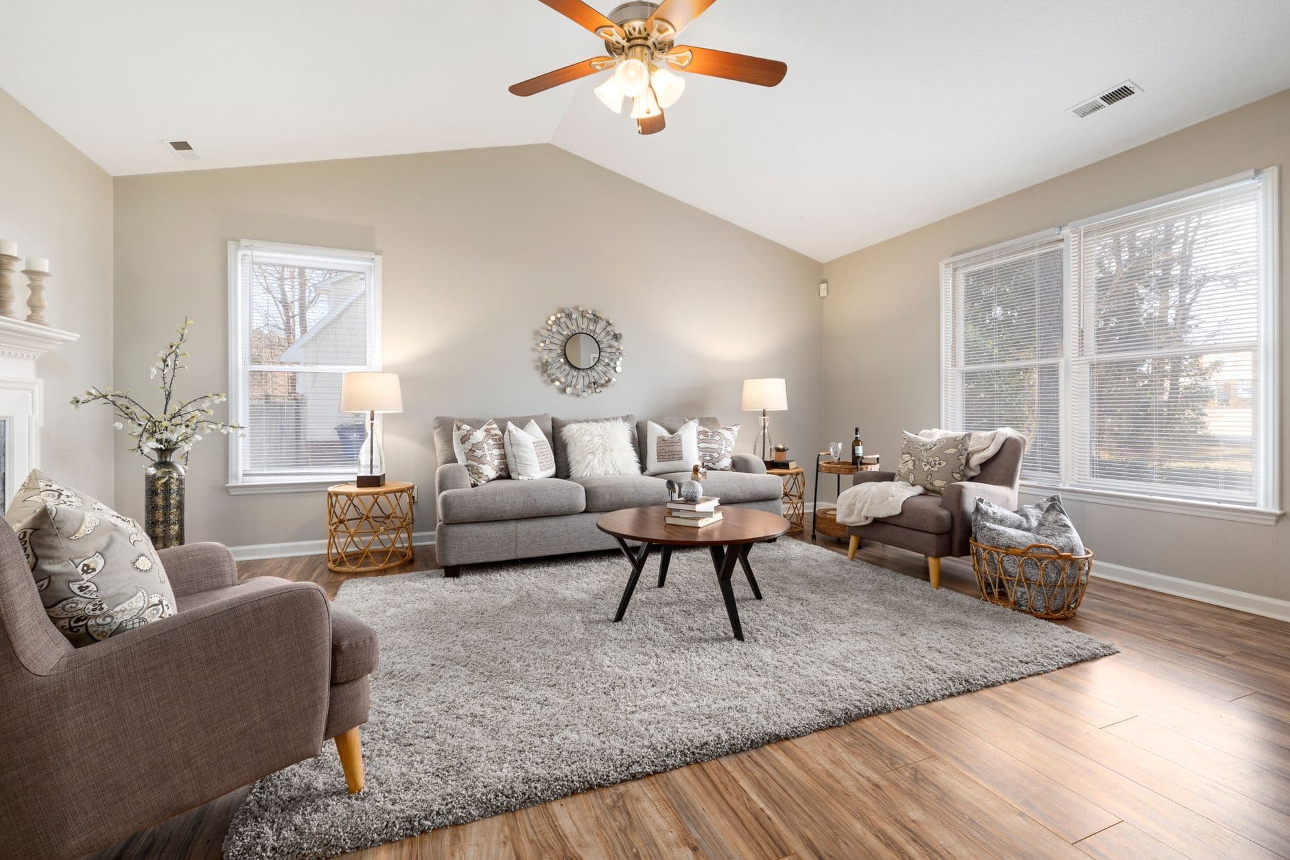 Bright and modern living room featuring cozy furnishings and natural lighting.